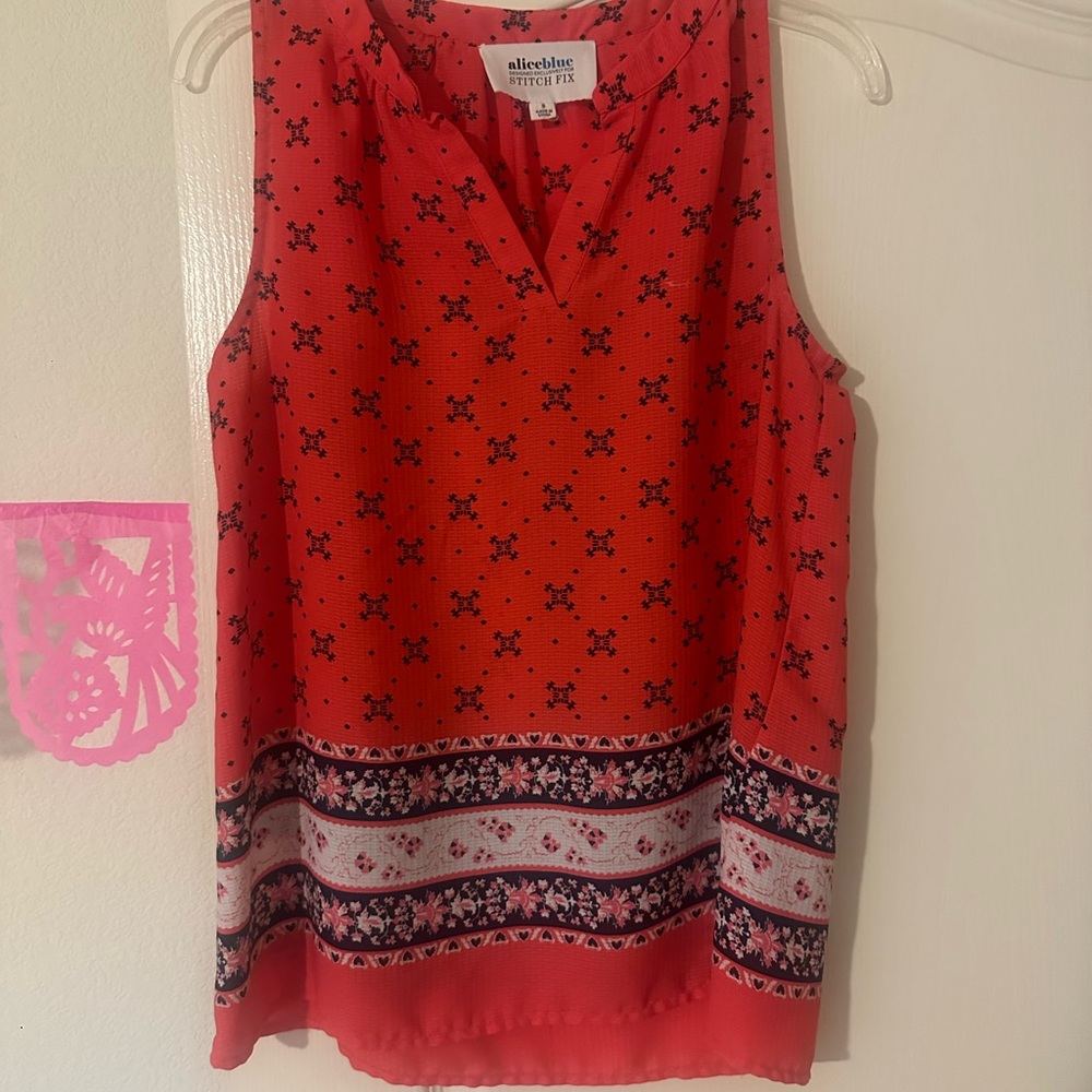 Vibrant orange and navy blouse